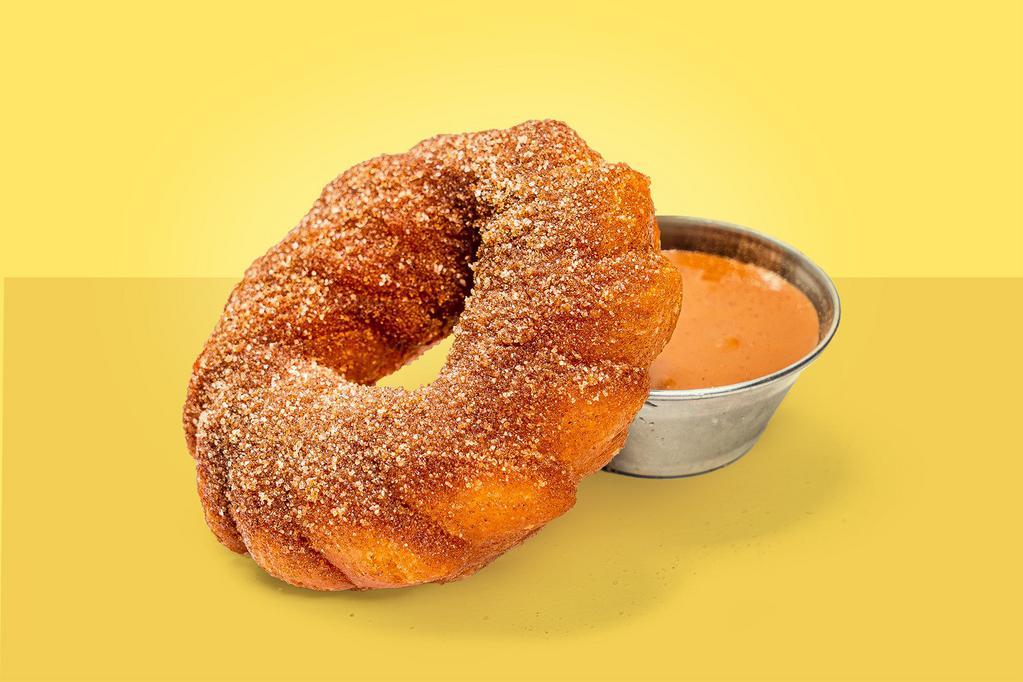 Churro Doughnut · Cinnamon sugar dusted churro doughnut with dulce de leche.