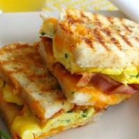 Bacon Egg and Cheese Panini · 2 eggs scrambled, bacon and grilled cheese.