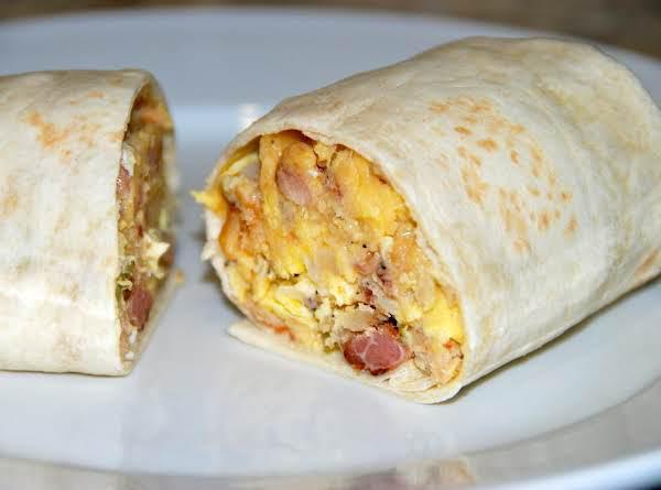 Classic Trio 3 Meat Wrap  · Ham, bacon, sausage, scrambled eggs and American cheese, served with hash browns. 