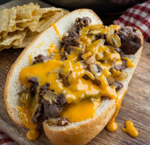 Original Philly Cheese Steak Sandwich · Tender sliced beef with sauteed mushrooms, green peppers, caramelized onions and melted cheese on a toasted, fresh hoagie roll.