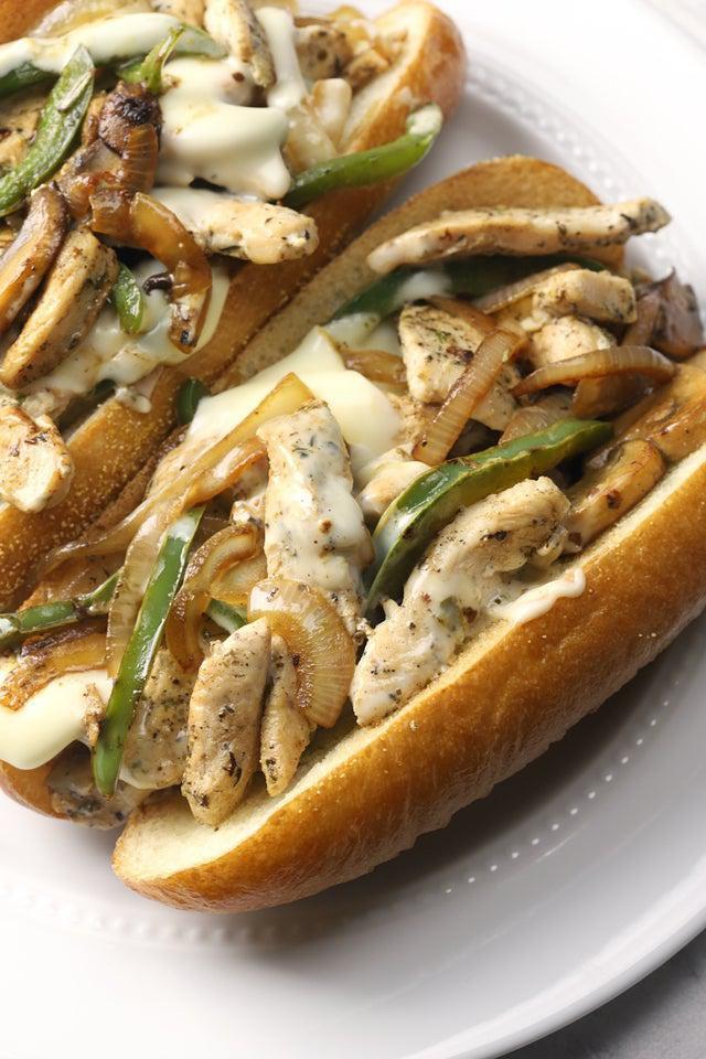 Chicken Phily Sandwich  · Tender sliced chicken with sauteed mushrooms, green peppers, caramelized onions and melted cheese on a toasted, fresh baked hoagie roll.