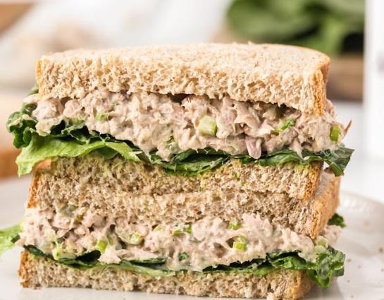 Tuna Salad Club Sandwich · Fresh white albacore tuna salad loaded with bacon, lettuce and tomato.