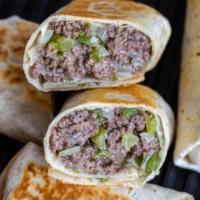 Philly cheesesteak Wrap · Tender sliced beef, sautéed green peppers, caramelized onions and melted cheese on a wrap.

