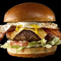 Sunshine Burger · Signature beef patty stacked with American cheese, fried egg, smoked bacon, lettuce, tomato ...
