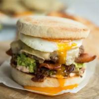 Ultimate Breakfast Beef Burger  · English muffins toasted, Sriracha mayo, hash browns, smashed avocado, bacon, cheeseburger, c...