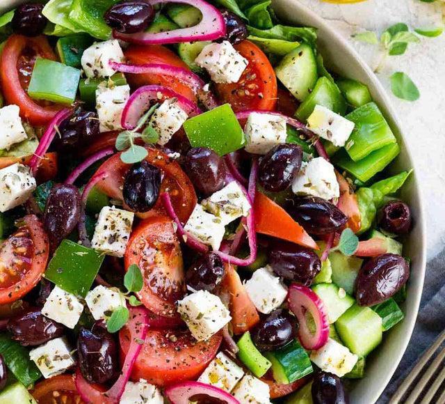 Greek Salad · Lettuce, tomato, feta cheese, Kalamata olives, cucumber and onions.