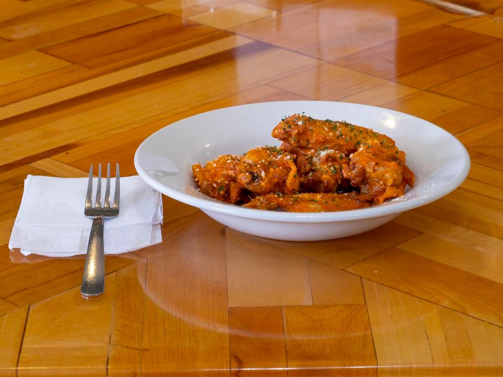 Chicken Wings · 6 jumbo wings baked 50%, deep fried 50%. Choice of  hot Buffalo, Parmesan ranch,  Lemon pepper