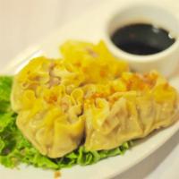 Steamed Dumplings · Steamed wonton paper filled with a blend of shrimp and mushrooms. Served with seasoning soy ...