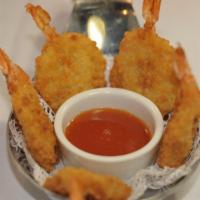 Butterfly Shrimp · Lightly battered and crispy fried shrimp. Served with our sweet and sour sauce.