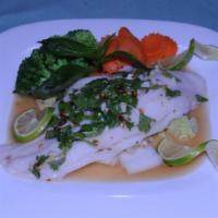 Steamed Fish · Steamed fillet of sawai served with lemon garlic and cilantro sauce.