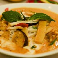 Red Curry · Spicy red curry simmered with your choice of meat, Thai coconut milk, bamboo shoots, bell pe...