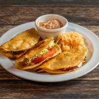 Fried Tacos · 3 crispy tacos filled with your choice of chicken, ground beef or shredded beef with salad a...