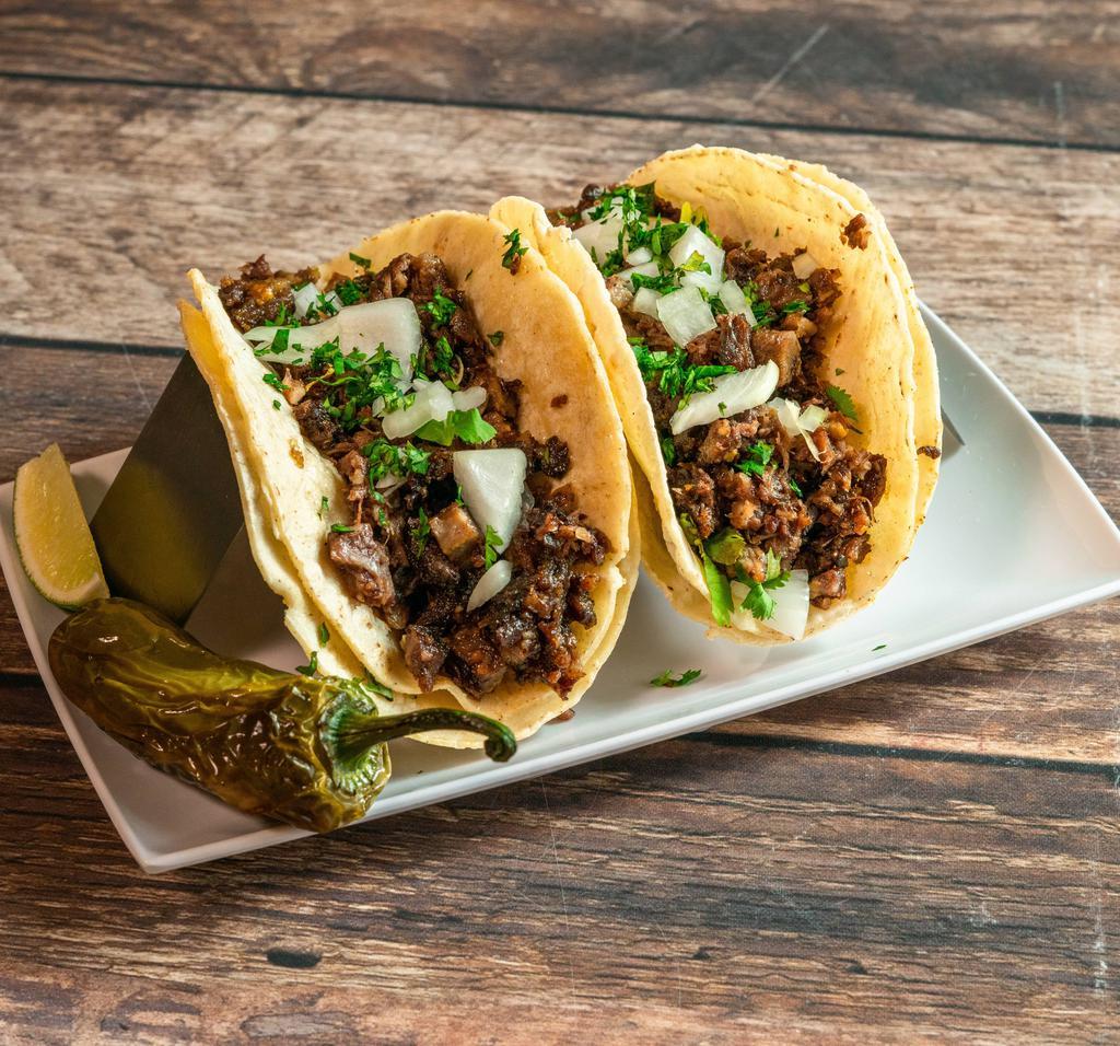 Tacos de Barbacoa · 4 corn tortillas filled with homemade style barbacoa served with rice, beans, cilantro and
fresh onions.