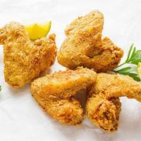 4 Fried Chicken Wings · Cooked wing of a chicken coated in sauce or seasoning.