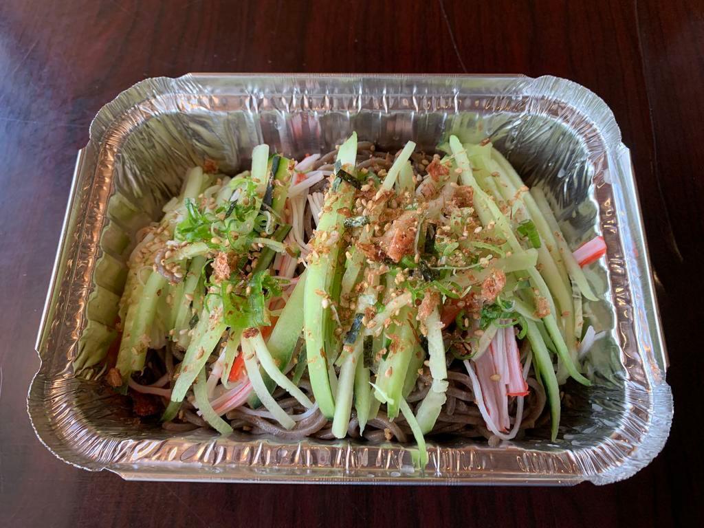 33. Zaru Soba · Chilled buckwheat noodles topped with cucumber, kani and bonito flakes with a ginger sauce.
