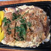 78. Katsu Don · Breaded fried pork cutlet, vegetables and egg over rice.