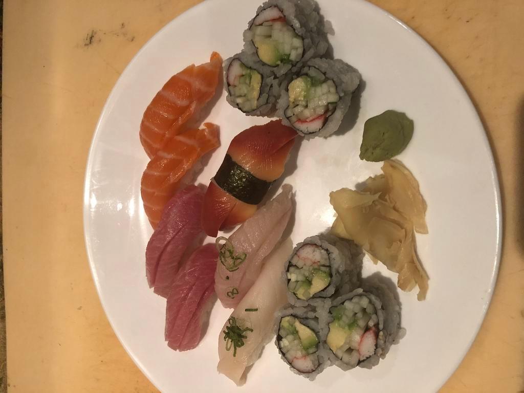 99. Sushi Regular · 7 pieces of sushi and a California roll.