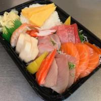 104. Chirashi · Assorted sashimi over a bowl of sushi rice.