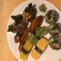 105. Veggie Sushi · 7 pieces of veggie sushi and a vegetables roll.