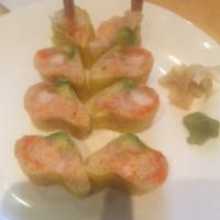 139. Yummy Tiger Roll · Shrimp tempura, lobster, avocado and tobiko in white seaweed.