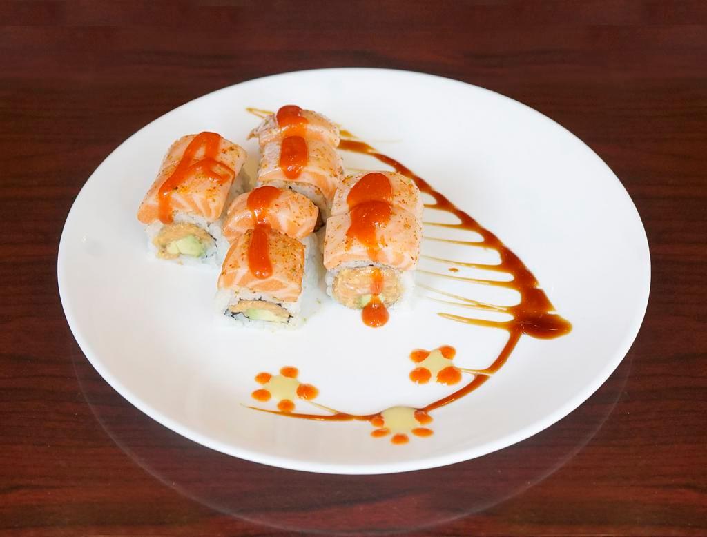 140f. Spicy Yaki Salmon Roll · Spicy salmon, avocado inside with lightly seared spicy salmon belly on top, served with chef's special sauce.