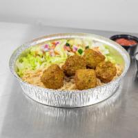 Falafel Over Rice · Freshly cooked all vegetarian, deep-fried to perfection, consisting of ground chickpeas and ...
