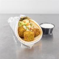 Falafel on Pita · Freshly cooked all vegetarian, deep-fried to perfection, consisting of ground chickpeas and ...