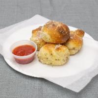 4 Garlic Knots · Extra fluffy knots, tossed with fresh garlic, chopped parsley, a blend of grated cheeses and...