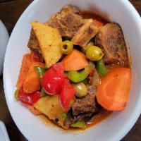 Kalderetang Kambing · goat meat  stewed with vegetables and liver paste. tomatoes, potatoes, olives, bell peppers,...