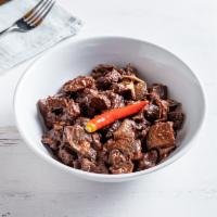 Dinuguan · Savory dish made with diced pork, pork innards and ears with pork
blood, and spices