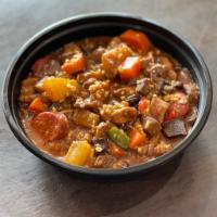 Menudo · with pork and sliced liver in tomato sauce with carrots and potatoes, peppers and raisins