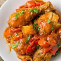 Chicken Afritada · Filipino stew made of chicken pieces, potatoes, carrots and bell peppers cooked in fresh tom...