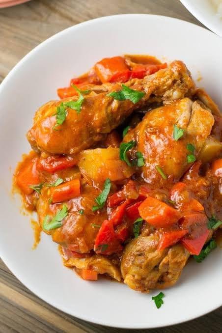 Chicken Afritada · Filipino stew made of chicken pieces, potatoes, carrots and bell peppers cooked in fresh tomato sauce