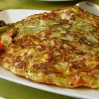 Tortang Talong · also known as eggplant omelette, is a fritter from Filipino cuisine made by pan-frying grill...