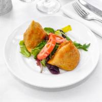 Vegetable Samosa · Mildly spiced potatoes, peas, cashew nuts, raisins stuffed in a lightly pastry and deep fried.