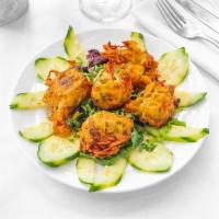 Onion Bhajias · Crisp fritters of anion julienne with mild spice.
