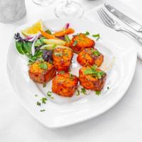 Fish Tikka · Salmon. Cubes of seasoned fish marinated in sour cream, aromatic herbs, and spices, skewered...