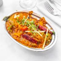 Kadai Chicken · Cubes of tender chicken cooked with dry spices, herbs, tomato, ginger, garlic, and garnished...