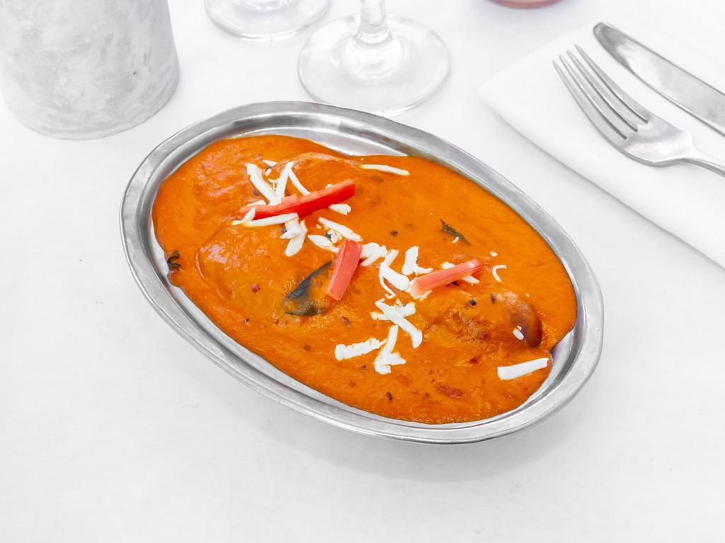 Malai Kofta · Dumplings made with an array of vegetables and cottage cheese, cooked with a delicate gravy made with fresh tomato puree, onions, garlic, red chili powder, coriander, ginger, turmeric, cloves and cinnamon.