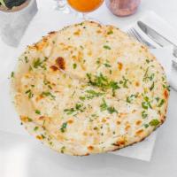 Garlic Nan · Leavened white flour bread basted with fresh garlic coriander and baked in a tandoor.