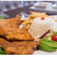 Pechuga a La Milanesa · Boneless chicken breast breaded in our special Peruvian seasoning, served with fries, white ...