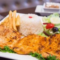 Pechuga a La Plancha · A sauteed marinated chicken breast served with french fries. White rice and our fresh salad.