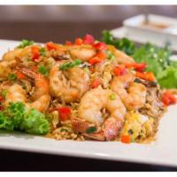 Chaufa de Camarones · Oriental inspired dish made with fried rice and stir fried shrimp, mixed with soy sauce, dic...