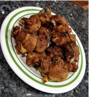 Fried Chicken Chunks (Chicharron de Pollo con Hueso) · Seasoned crispy chicken with a choice of side.