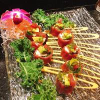 Fairy Tuna Roll · Spicy snow crab and spring mix wrapped in paper-thin tuna, with cilantro, and spicy mayo sau...