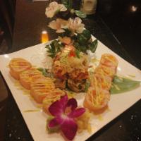 Volcano Roll · Deep-fried Kani roll, crunchy spicy tuna, and spicy salmon, scallions, and caviar on top. Se...