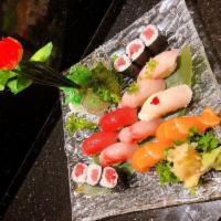 Sushi Deluxe · 9 pieces chef’s choice sushi and tuna roll. Raw item.