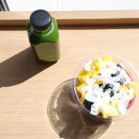 Summer Breeze Pitaya Bowl · Pitaya topped with mango, pineapple, blueberry, coconut flakes, granola.