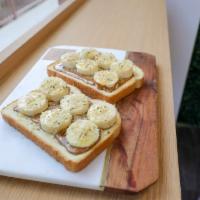 Almond Butter Toast · Almond butter, banana, hemp seeds, honey.