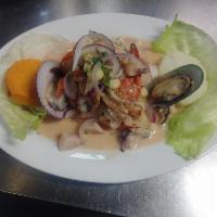 27. Ceviche Mixto · Fish ceviche served with a variety of cooked and chilled seafood, marinated with traditional...